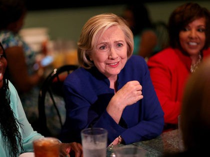 COLUMBIA, SC - MAY 27: Democratic Presidential Candidate Hillary Clinton sits in on a round table discussion as she visits the Kikis Chicken and Waffles restaurant on May 27, 2015 in Columbia, South Carolina. Hillary Clinton continues to campaign throughout the country for the Democratic nomination. (Photo by Joe Raedle/Getty …
