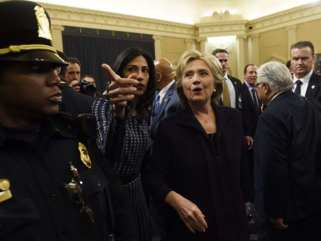 Former Secretary of State and Democratic Presidential hopeful Hillary Clinton (C) walks next to Huma Abedin (2L) after Clinton testified before the House Select Committee on Benghazi on Capitol Hill in Washington, DC, October 22, 2015. Clinton took the stand to defend her role in responding to deadly attacks on …