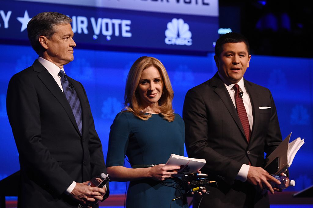 Debate moderators John Harwood (L), Becky Quick (C) and Carl Quintanilla take the stage at the third Republican Presidential Debate hosted by CNBC, October 28, 2015 at the Coors Event Center at the University of Colorado in Boulder, Colorado. AFP PHOTO / ROBYN BECK (Photo credit should read ROBYN BECK/AFP/Getty Images)