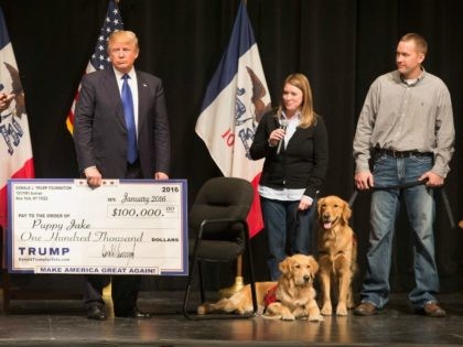 Republican presidential candidate Donald Trump presented a check to the Puppy Jake on January 30, 2016 in Davenport, Iowa.