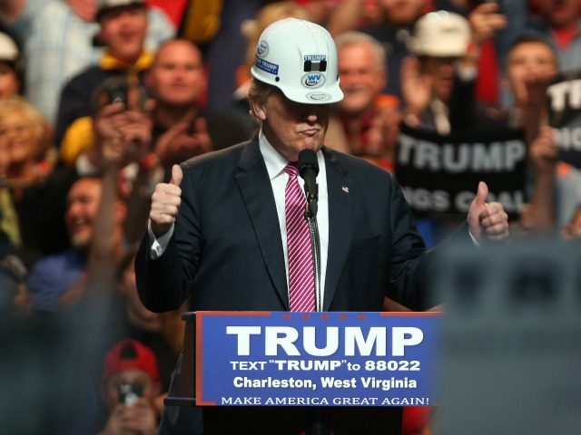 Republican Presidential candidate Donald Trump models a hard hat in support of the miners during his rally at the Charleston Civic Center on May 5, 2016 in Charleston, West Virginia.