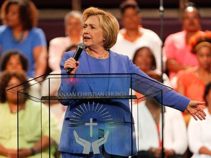 LOUISVILLE, KY - MAY 15: Democratic presidential candidate Hillary Clinton (L) addresses the crowd during a campaign stop at Canaan Missionary Church May 15, 2016 in Louisville, Kentucky. Clinton is preparing for Kentucky's May 17th primary. (Photo by John Sommers II/Getty Images)