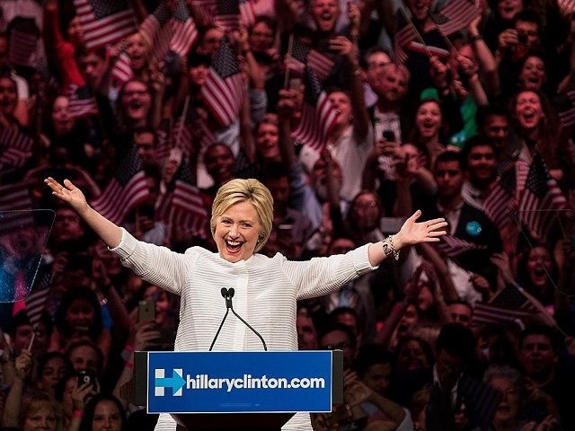 NEW YORK, NY - JUNE 7: Democratic presidential candidate Hillary Clinton arrives onstage during a primary night rally at the Duggal Greenhouse in the Brooklyn Navy Yard, June 7, 2016 in the Brooklyn borough of New York City. Clinton has secured enough delegates and commitments from superdelegates to become the …