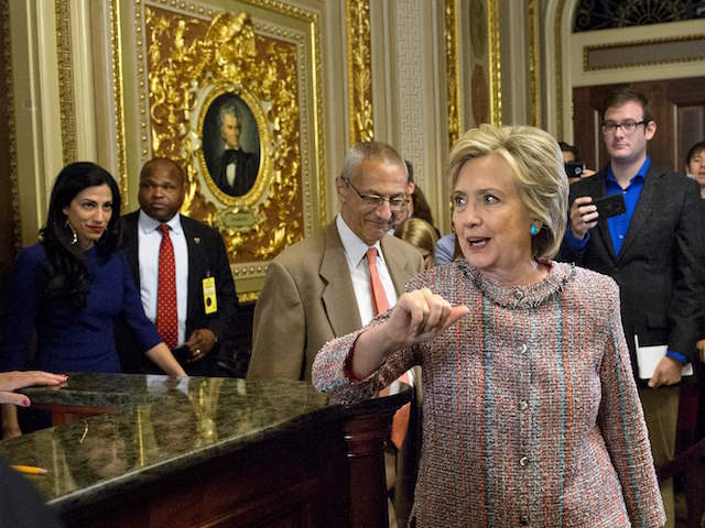 US Democratic presidetial candidate Hillary Clinton (C) leaves with aid Huma Abedin (L) and Campaign Chairman John Podesta (3L) after a meeting with Senate Democrats on Capitol Hill July 14, 2016 in Washington, DC. / AFP / Brendan Smialowski (Photo credit should read BRENDAN SMIALOWSKI/AFP/Getty Images)