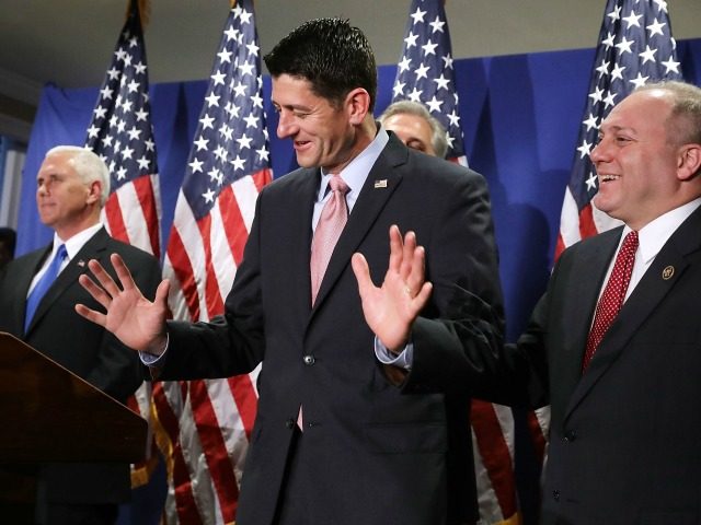 Speaker of the House Paul Ryan (R-WI) (C) reacts to being asked about his previous relucta