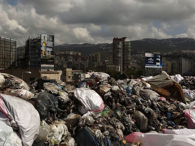 Garbage piles up at a temporary dump on a highway in the town of Jdeideh, north of the Leb