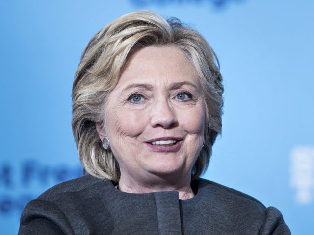 Democratic presidential nominee Hillary Clinton listens as Senator Bernie Sanders (I-VT) s