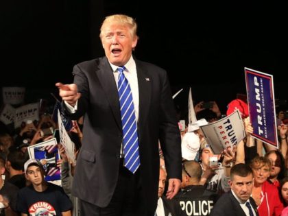 NOVI, MI - SEPTEMBER 30: Republican presidential nominee Donald Trump walks off of the st