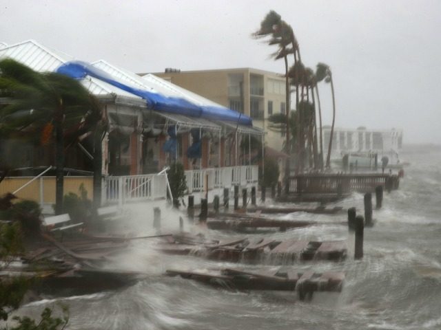 Heavy waves caused by Hurricane Matthew pounds the boat docks at the Sunset Bar and Grill,
