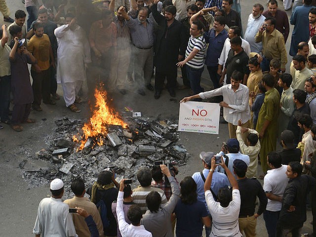 Pakistani shopkeepers and traders burn Indian products including TV transmission systems and CDs during a demonstration in Lahore on October 8, 2016, in support of Kashmiri Muslims. Tensions have spiked since New Delhi said the previous week that it had launched "surgical strikes" on militant posts across the disputed border …