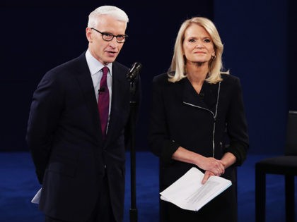 ST LOUIS, MO - OCTOBER 09: Moderator Anderson Cooper of CNN (L) and moderator Martha Raddatz of ABC speak before the town hall debate at Washington University on October 9, 2016 in St Louis, Missouri. This is the second of three presidential debates scheduled prior to the November 8th election. …