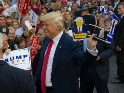 idate for President Donald J Trump greets supporters at a rally at Ambridge Area Senior Hi