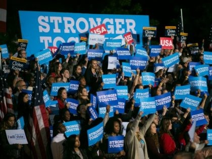 People watch Democratic presidential nominee Hillary Clinton speak at Ohio State Universit