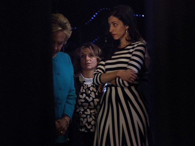 Democratic presidential nominee Hillary Clinton (L) waits back stage with hair stylist Isabelle Goetz (C) and close aid Huma Abedin before speaking during a fundraiser at the Paramount Theater October 14, 2016 in Seattle, Washington. / AFP / Brendan Smialowski (Photo credit should read BRENDAN SMIALOWSKI/AFP/Getty Images)