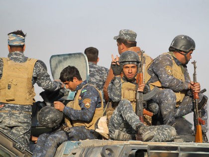 Iraqi forces deploy in the area of al-Shourah, some 45 kms south of Mosul, as they advance