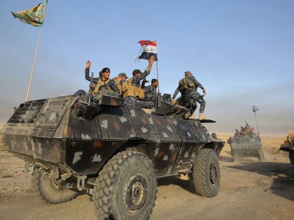Iraqi forces deploy in the area of al-Shourah, some 45 kms south of Mosul, as they advance towards the city to retake it from the Islamic State (IS) group jihadists, on October 17, 2016. Iraqi Prime Minister Haider al-Abadi announced earlier in the day that the long-awaited operation to recapture …