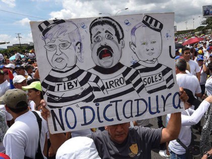 TOPSHOT - People protest against the government of Venezuelan President Nicolas Maduro, in