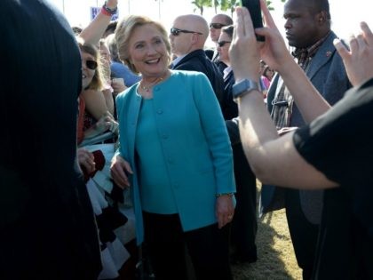 Democratic presidential nominee Hillary Clinton poses for photos with supporters at a rall