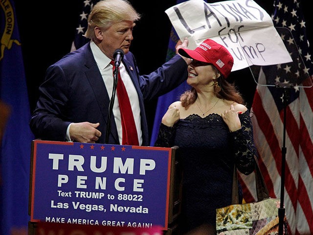 A Latino supporter speaks on stage with Republican presidential candidate Donald Trump during a campaign rally at the Venetian Hotel on October 30, 2016 in Las Vegas, Nevada. / AFP / John GURZINSKI (Photo credit should read JOHN GURZINSKI/AFP/Getty Images)