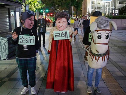 Protesters wear Park Geun Hye Mask with performance during an anti-President protest in Seoul, South Korea, on 27 October 2016. An influence-peddling scandal engulfing President Park Geun-hye has put the spotlight on the most powerful office in South Korea, rekindling interest in potential presidential candidates for next Decembers election. Park, …