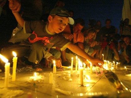 People light candles in front of Ghazala Gardens Hotel July 24, 2005 in the resort town of Sharm el-Sheik, Egypt. A rapid series of explosions killed over 80 people in the Egyptian Red Sea resort in the early morning hours of July 23 devastating a mall, a luxury hotel and …