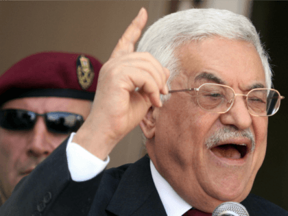 Palestinian President Mahmud Abbas gestures as he addresses a crowd of demonstrators at the Palestinian Authority headquarters in the West Bank city of Ramallah, 30 August 2006. Workers from a cross section of trade unions representing Palestinian Authority employees marched to the PA headquarters to demand their salaries. Unemployment levels …