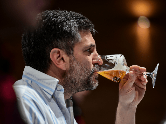 A sommelier tastes beers during the 2016 Cervezas de America Cup, in Santiago, on Septembe