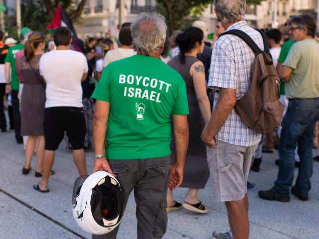Pro Palestinians demonstrators gather in front of the city hall in Saint-Etienne, central eastern France, to protest against racism in football before the UEFA Europa League play-off football match between AS Saint-Etienne and Beitar Jerusalem on August 25, 2016. / AFP / ROMAIN LAFABREGUE (Photo credit should read ROMAIN LAFABREGUE/AFP/Getty …