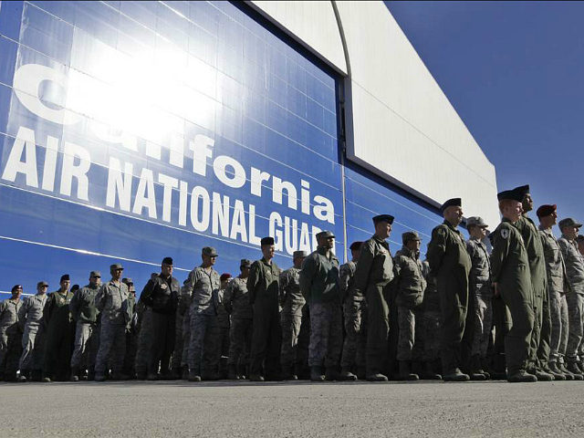 FILE - In this Nov. 30, 2011 file photo, California Army National Guard soldiers watch the