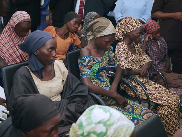 In this photo released by the Nigeria State House, freed Chibok school girls sit during a