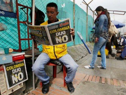A man reads a newspaper with the headline that reads in Spanish: "Colombia said No" in Bogota, Colombia, Monday, Oct. 3, 2016. Voters rejected a peace deal with leftist rebels of the Revolutionary Armed Forces of Colombia, FARC, by a razor-thin margin in a national referendum Sunday, dismissing years of …