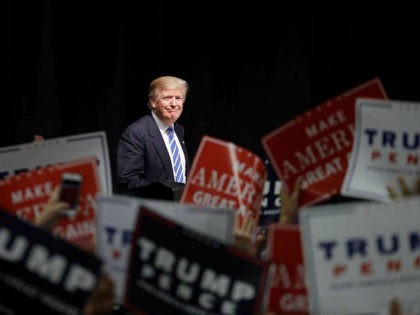 Republican presidential candidate Donald Trump takes the stage at a rally, Wednesday, Sept