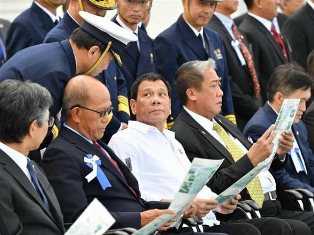 Philippine President Rodrigo Duterte (3rd from L) watches the Japan Coast Guard's training