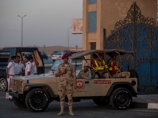 ilitary and members of the Egyptian police force stand guard outside the El-Mosheer Tantaw