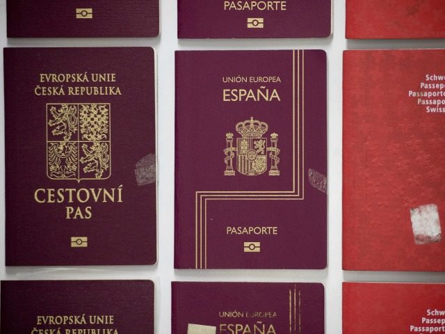 Fake passports are displayed at the immigration bureau in Bangkok on February 10, 2016 aft