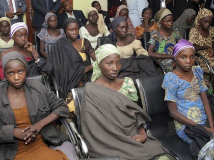 FILE - In this Thursday, Oct. 13, 2016, file photo released by the Nigeria State House, Chibok school girls recently freed from Boko Haram captivity are seen during a meeting with Nigeria's Vice President Yemi Osinbajo, in Abuja, Nigeria. Conflicting reports are emerging Friday about whether the first negotiated release …
