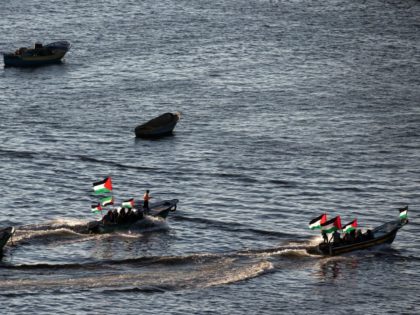 Palestinians sail boats bearing their national flag in the port of Gaza City in support of the Gaza-bound flotilla of international female activists attempting to break the Israeli blockade on the Hamas-run Gaza Strip on October 5, 2016. A group of activists seeking to break Israel's decade-long blockade of the …