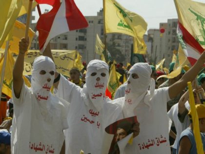 Hezbollah supporters wave flags during a ''Victory over Israel'' rally in Beirut's suburbs on September 22, 2006 in Beirut, Lebanon. Hezbollah leader Sayyed Hassan Nasrallah reportedly said that Hezbollah would not disarm until a Lebanese government capable of protecting the country was in place during the rally. (Photo by Salah …