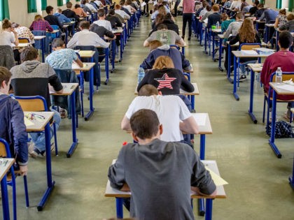 High school students sit behind desks during the philosophy exam, the first test session of the 2016 baccalaureate (high school graduation exam) on June 15, 2016 in Dijon, France. (Sipa via AP Images)