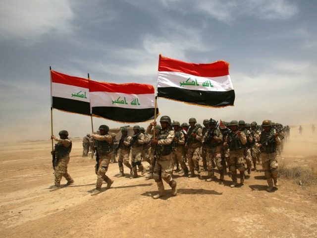 Thousands of Iraqi soldiers take part in a training exercise led by the Spanish Army and u