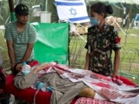 An injured Nepalese woman arrives on stretcher to be treated at the Israeli field hospital in Kathmandu on May 1, 2015, following a 7.8 magnitude earthquake which struck the Himalayan nation on April 25. Desperate survivors living at ground zero of Nepal's earthquake felt abandoned to their fate after losing …