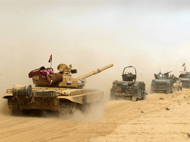 Iraqi forces deploy on October 17, 2016 in the area of al-Shurah, some 45 kms south of Mos