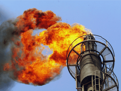 BAGHDAD, IRAQ - APRIL 24: Fire burns from an oil distillation tower at the Al-Doura Oil Refinery April 24, 2003 in Baghdad, Iraq. The refinery, built in 1952, is the largest in Baghdad and would typically produce 110,000 barrels of oil a day. However, due to the problems associated with …