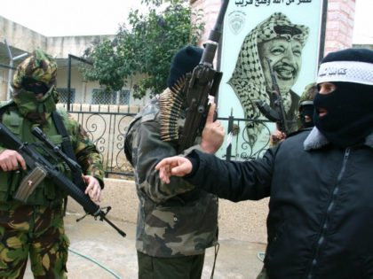 Armed militants from Fatah's Al-Aqsa Martyrs Brigades hold a press conference in the refugee camp of Amaari in the West Bank city of Ramallah, calling the Palestinian Authority to delay the general elections, 26 December 2005. The ruling Fatah faction was given the green light Monday to fuse its list …