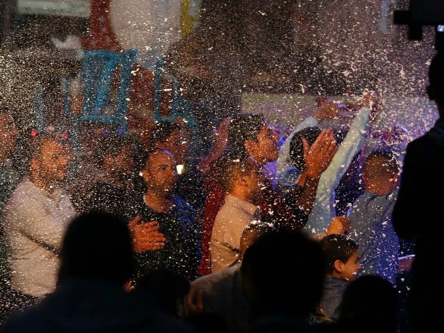 Palestinian men dance during a wedding party in Gaza City on April 4, 2016. In the coastal