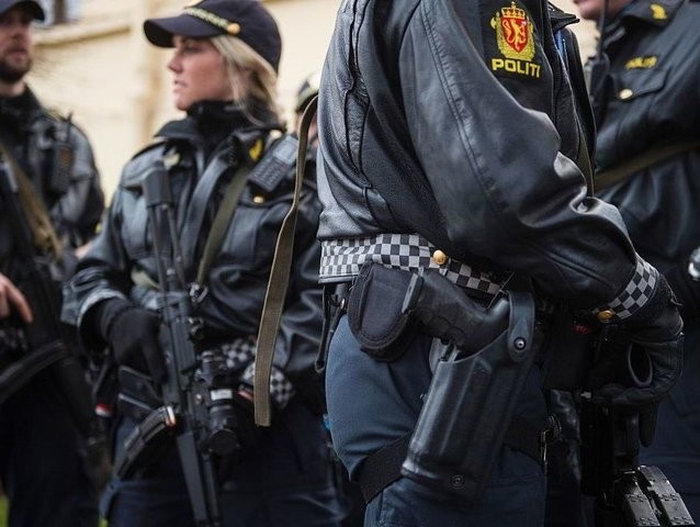 Armed police guard the Nobel institute ahead of a press conference with the Nobel Peace Pr