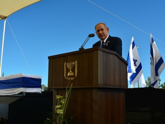 In this GPO handout, Israeli Prime Minister Benjamin Netanyahu speaks at the funeral of Sh