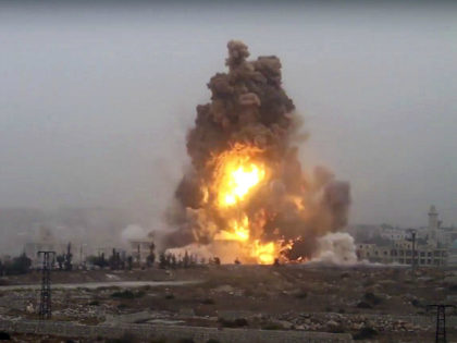 This frame grab from video provided by Thiqa news agency, a Syrian opposition media outlet that is consistent with independent AP reporting, shows flames rises from an explosive vehicle bomb that attacked a Syrian government position, in southwest of Aleppo, Syria, Friday, Oct, 28, 2016. Rebels detonating three vehicle-borne explosives …