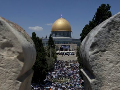 Palestinian worshipers pray outside the Dome of the Rock at the Al-Aqsa Mosque compound in Jerusalem during the third Friday prayers of the Muslim holy fasting month of Ramadan on July 26, 2013. AFP PHOTO/AHMAD GHARABLI (Photo credit should read AHMAD GHARABLI/AFP/Getty Images)