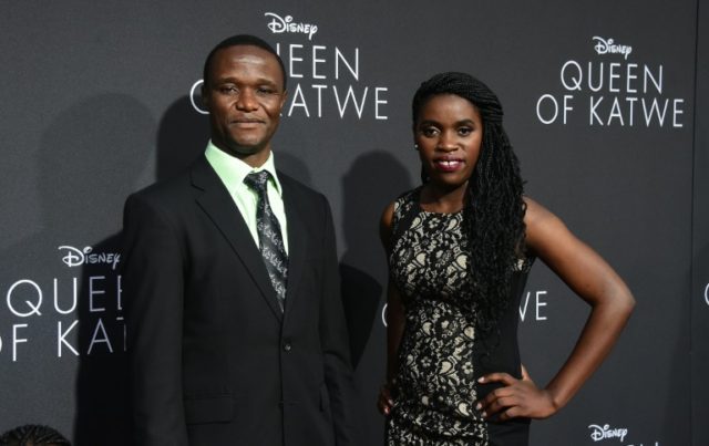 Robert Katende and Phiona Mutesi (R), whose life on which the story is based, pose on arri